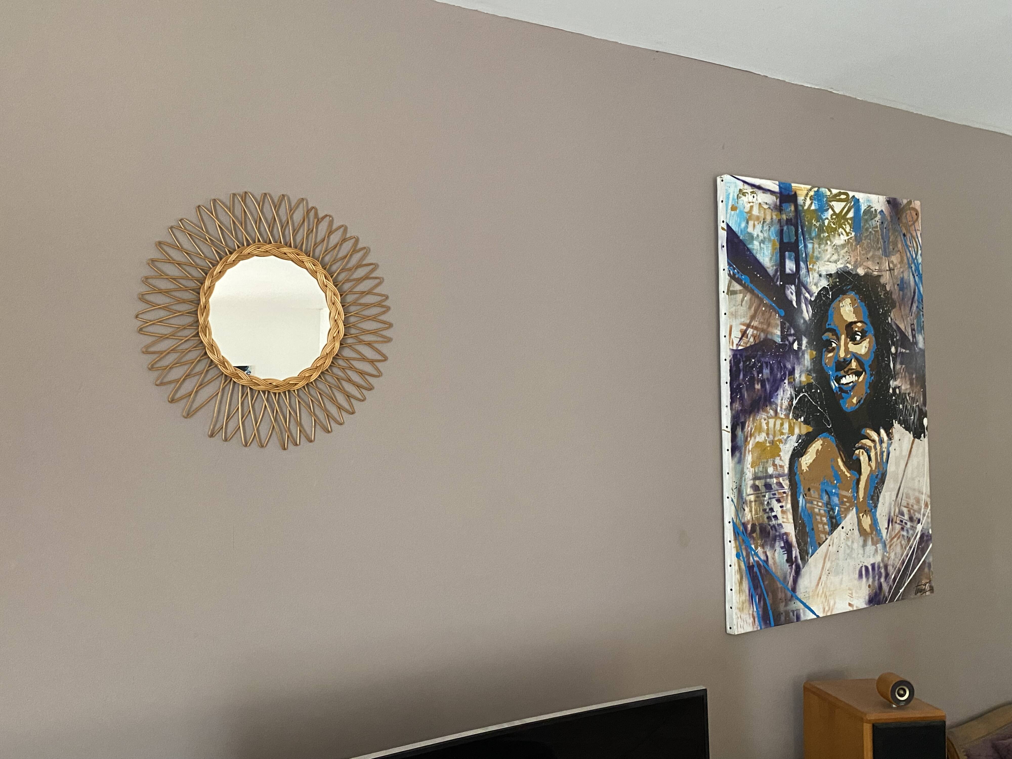 Sun mirror in woven rattan. 50cm. 1960.