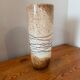 Large hand-blown glass vase in brown and beige.