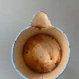 Old pitcher or milk jug in painted sheet metal