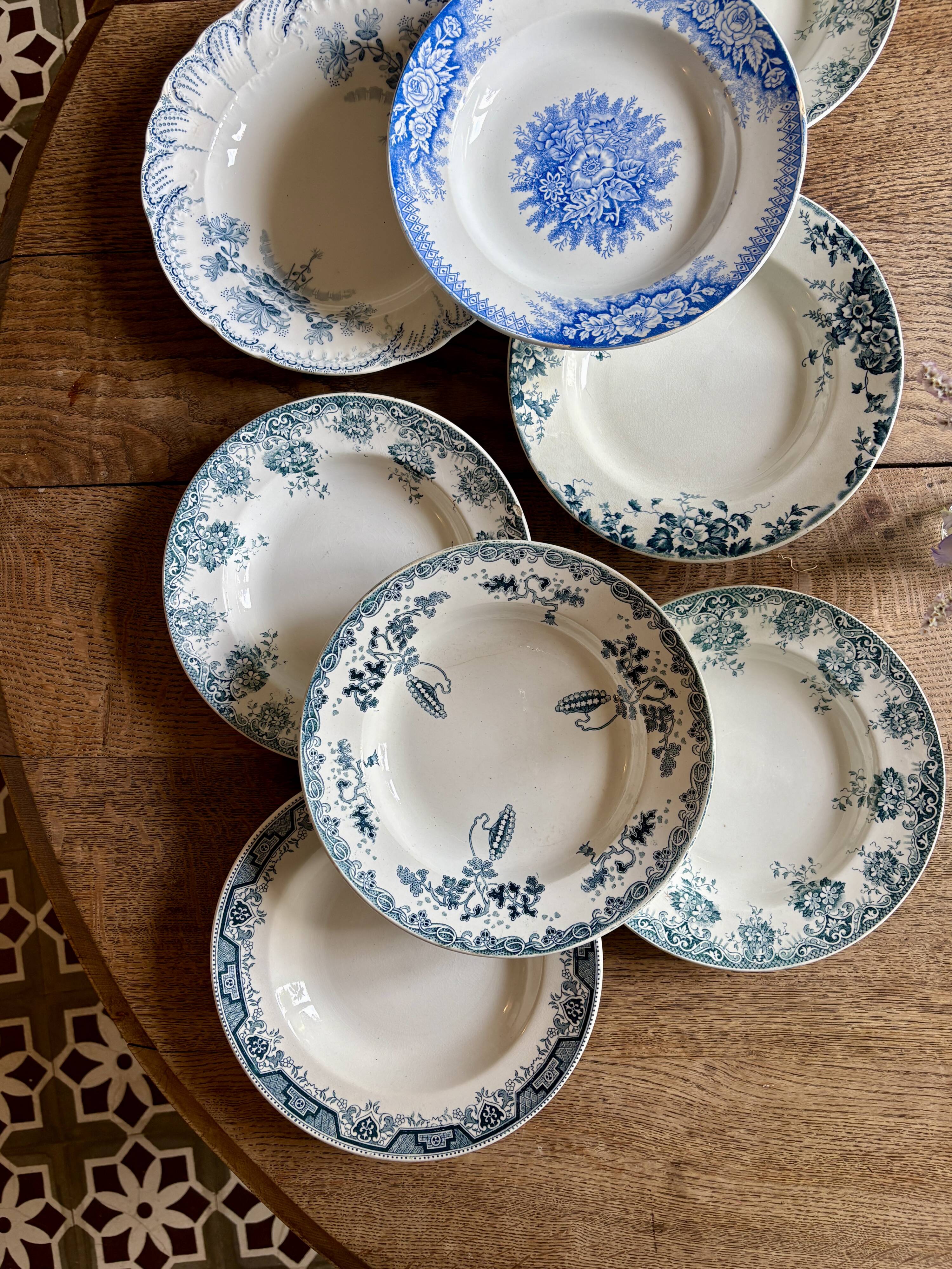 Set of 8 mismatched antique ironstone deep plates.
