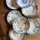 Set of 8 mismatched antique ironstone deep plates.