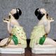Pair of polychrome porcelain night light statues in Art Nouveau style