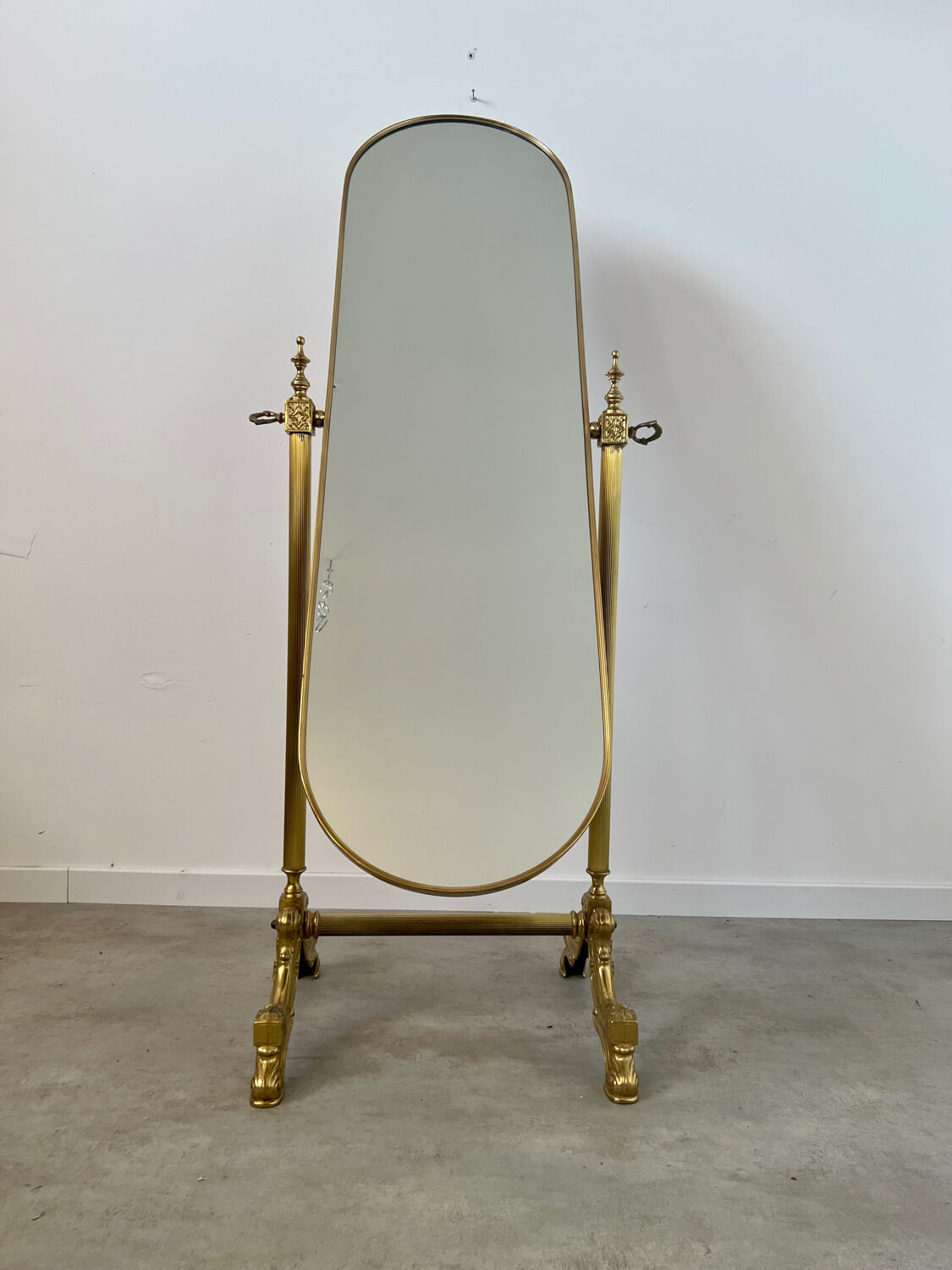 Old free-standing mirror in gilded brass in psychedelic neoclassical style Years 40 France