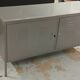 Small mouse gray industrial piece of furniture/sideboard.