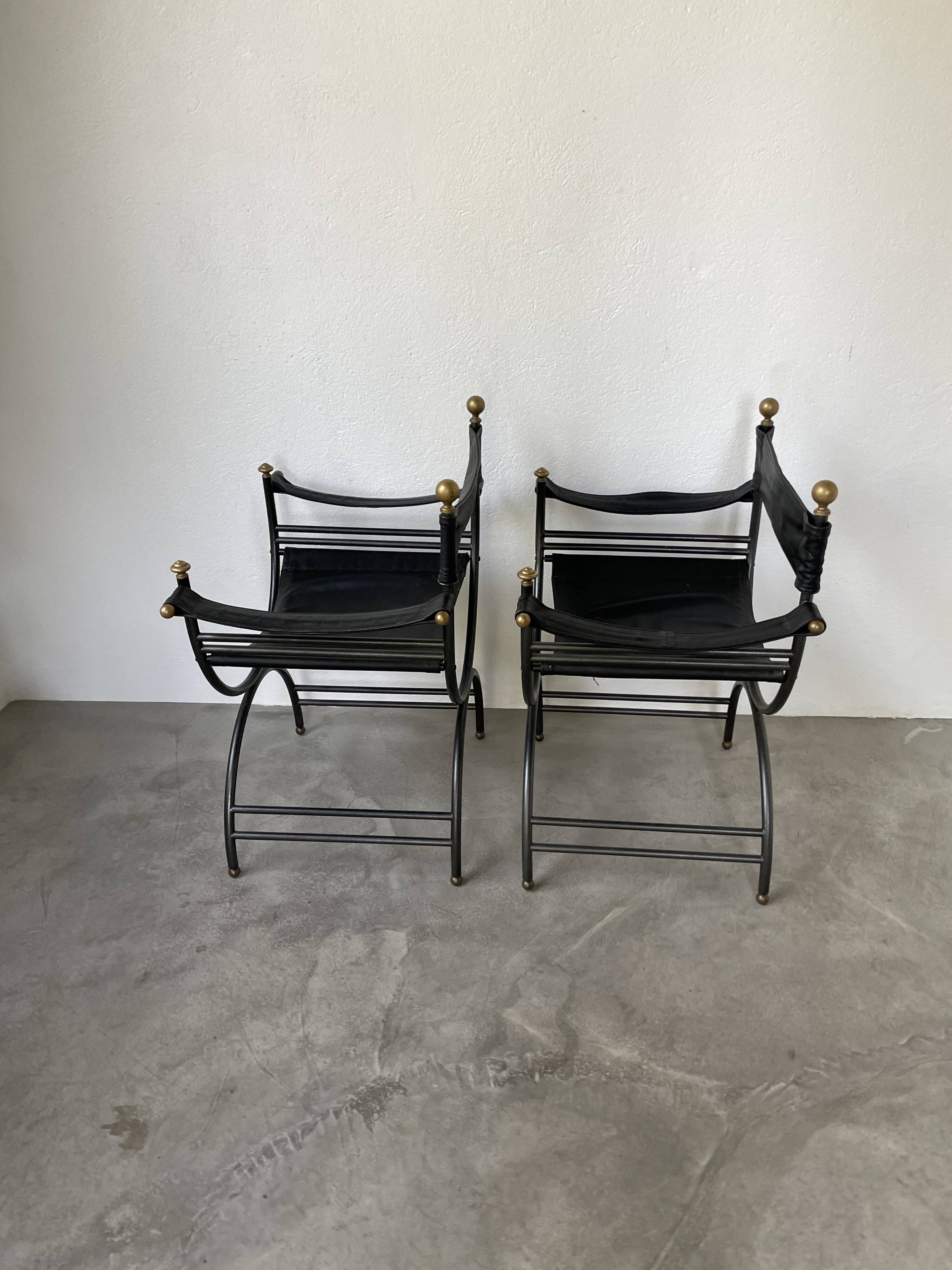 Pair of leather “curule” emperor armchairs