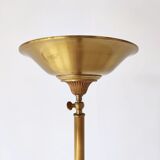 Halogen floor lamp in golden brass