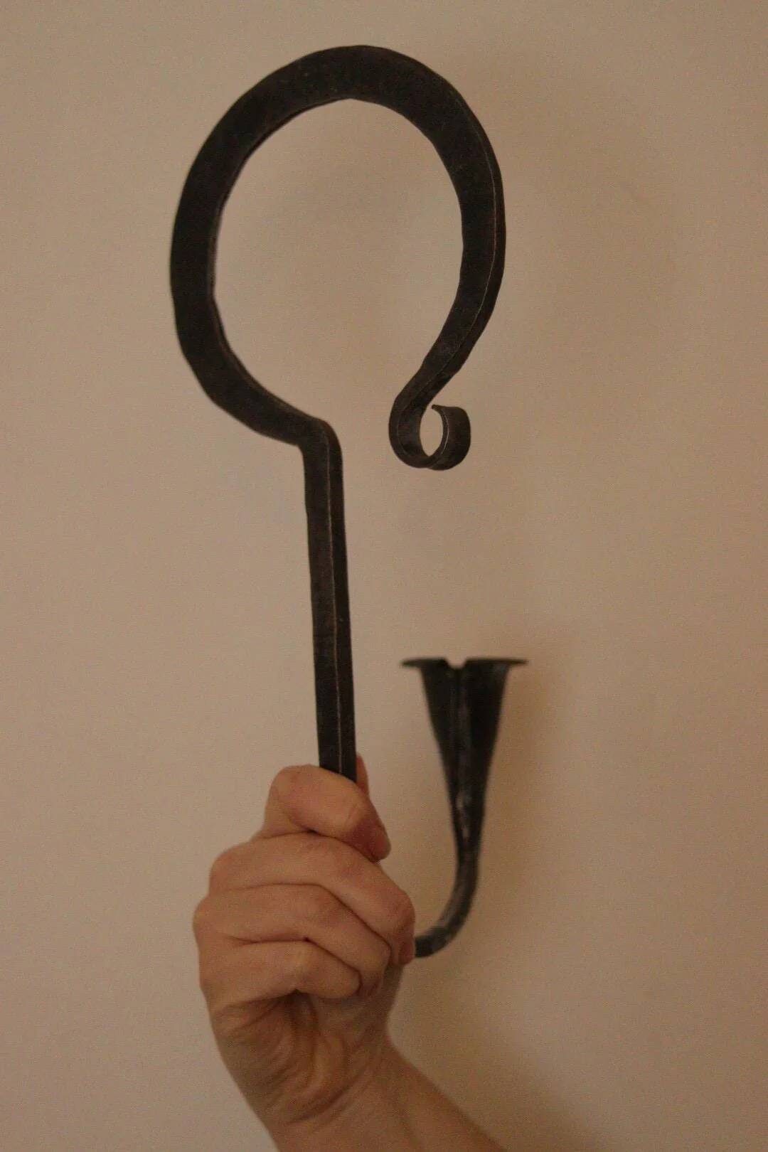 Pair of Swedish wall sconces in wrought iron, mid-20th century style, signed Akta.