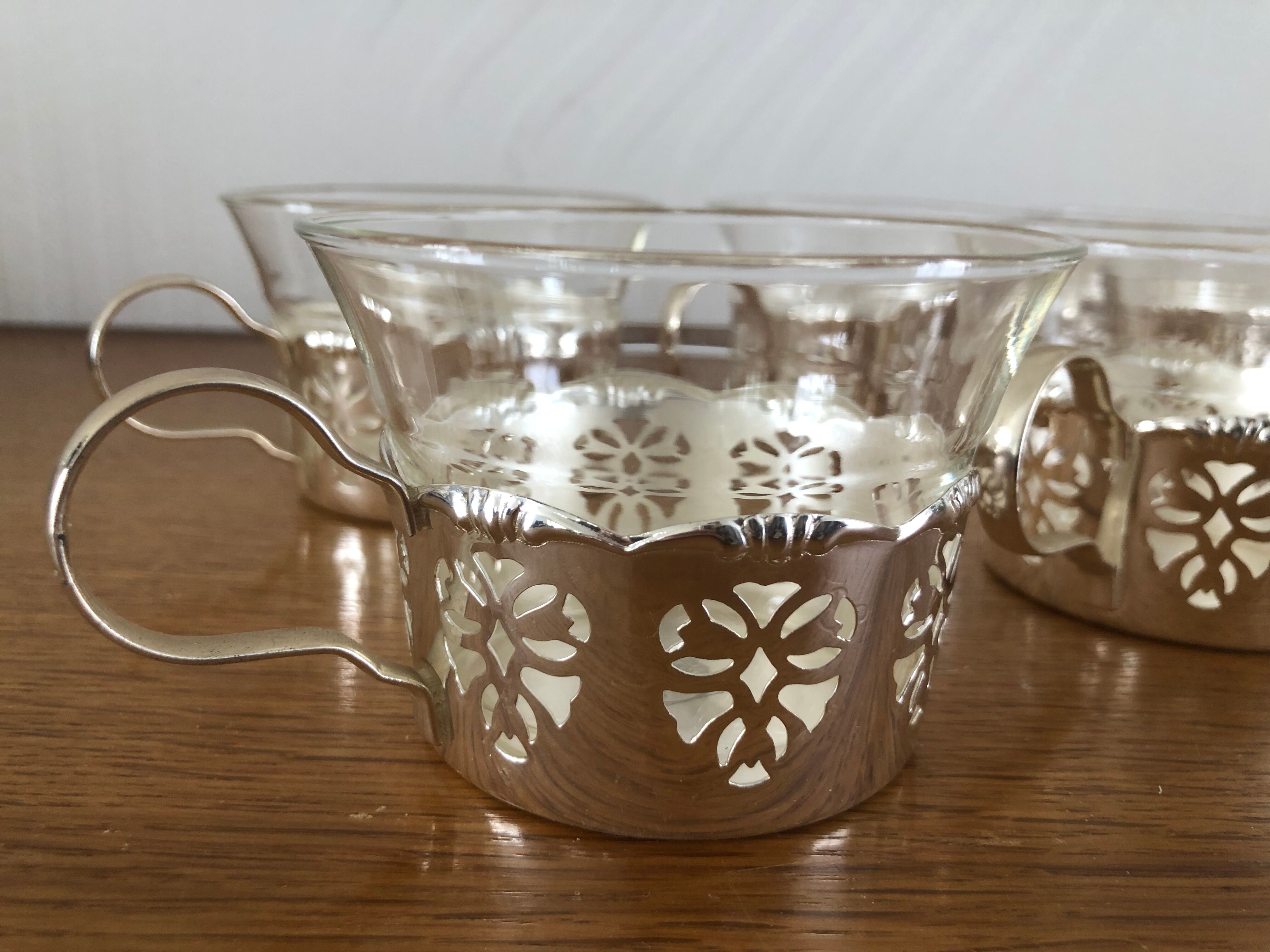 6 tea cups with silver metal support