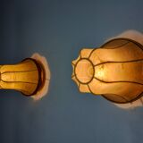 Pair of "cocoon" wall lights, pear shape, resin and pine, Italy, 1970