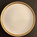 7 flat plates in porcelain of Limoges Bernardaud, decoration of golden Greek, XXth century