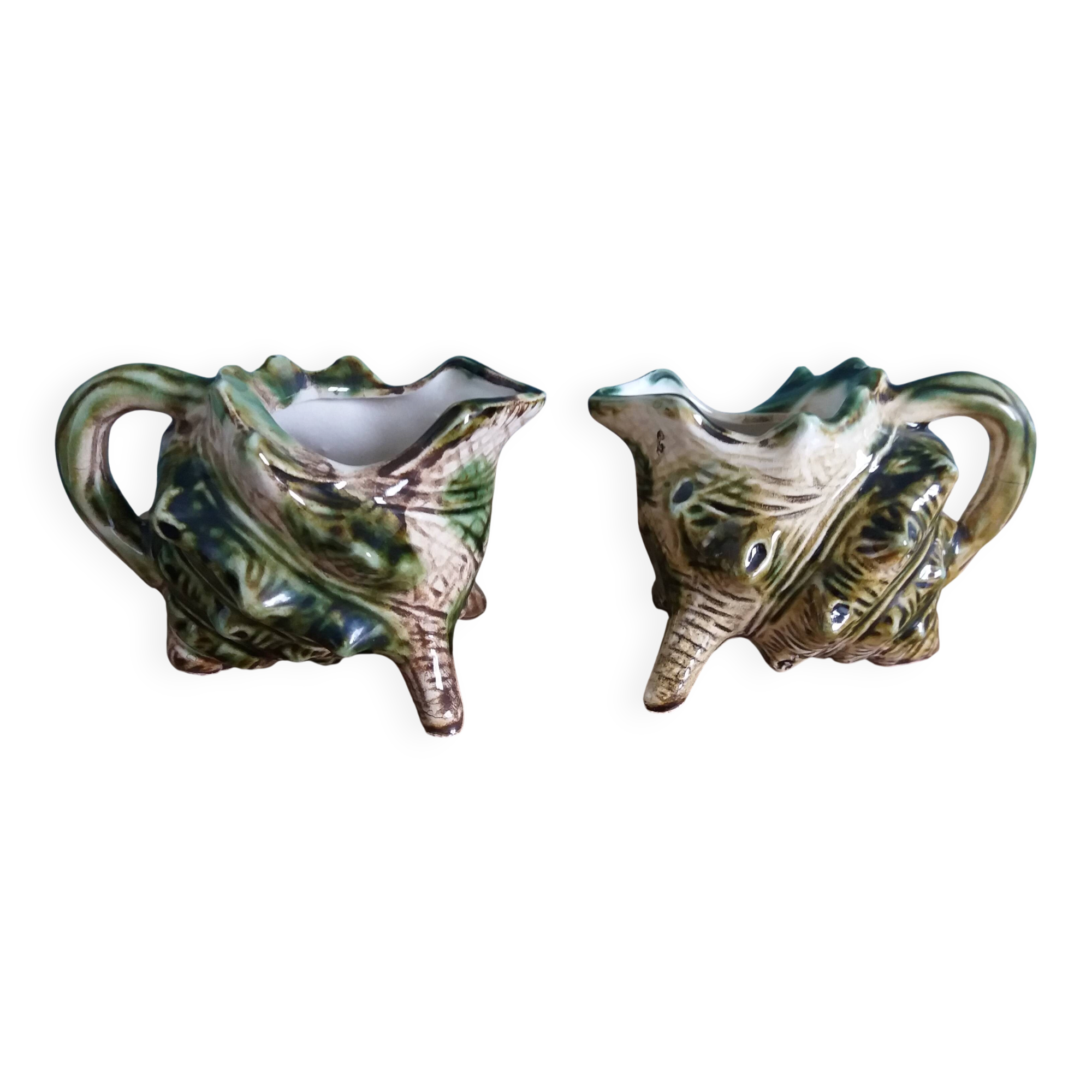 Animal-shaped milk jug shell in slipware.