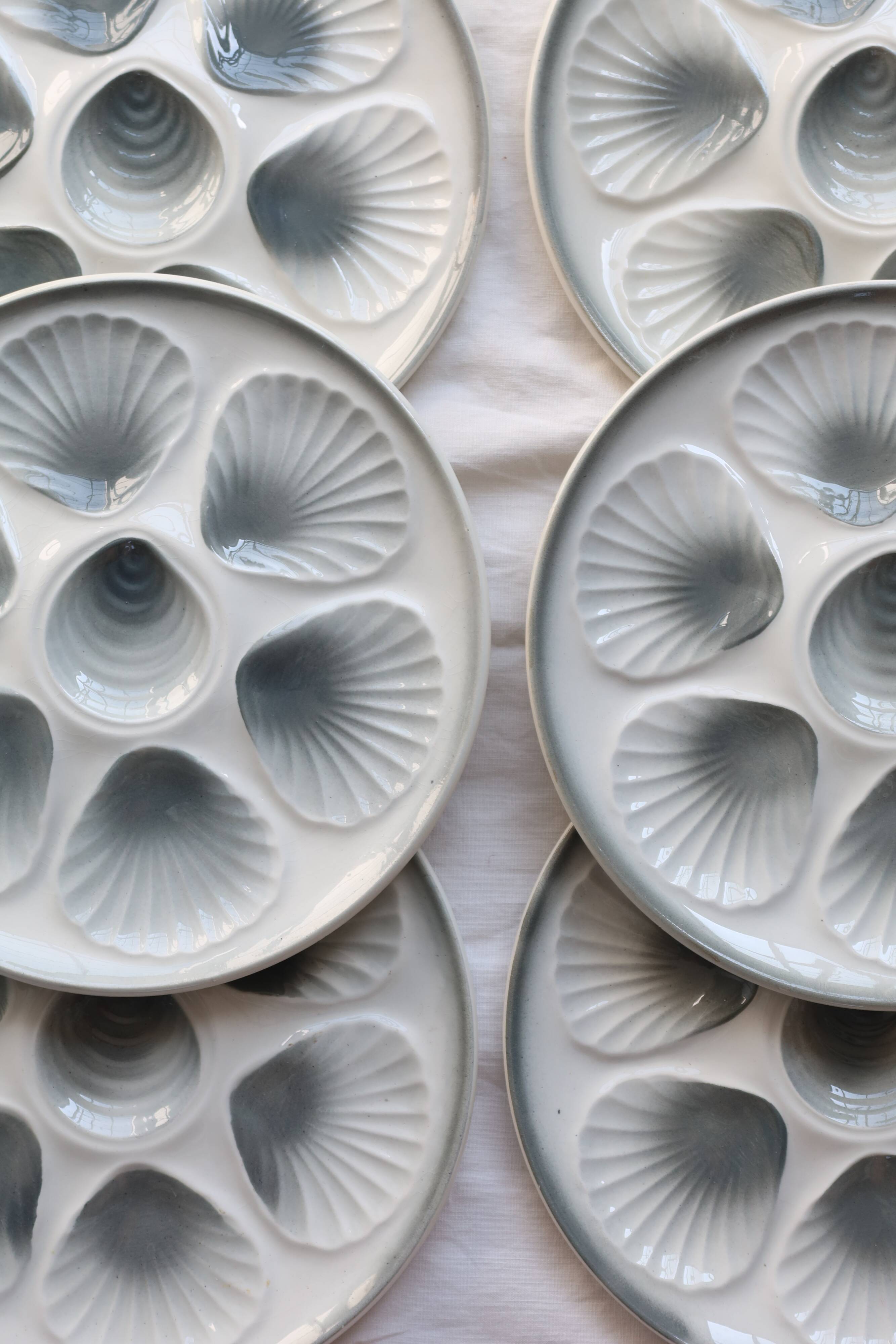 6 vintage Moulin des Loups earthenware oyster plates in shades of blue and grey
