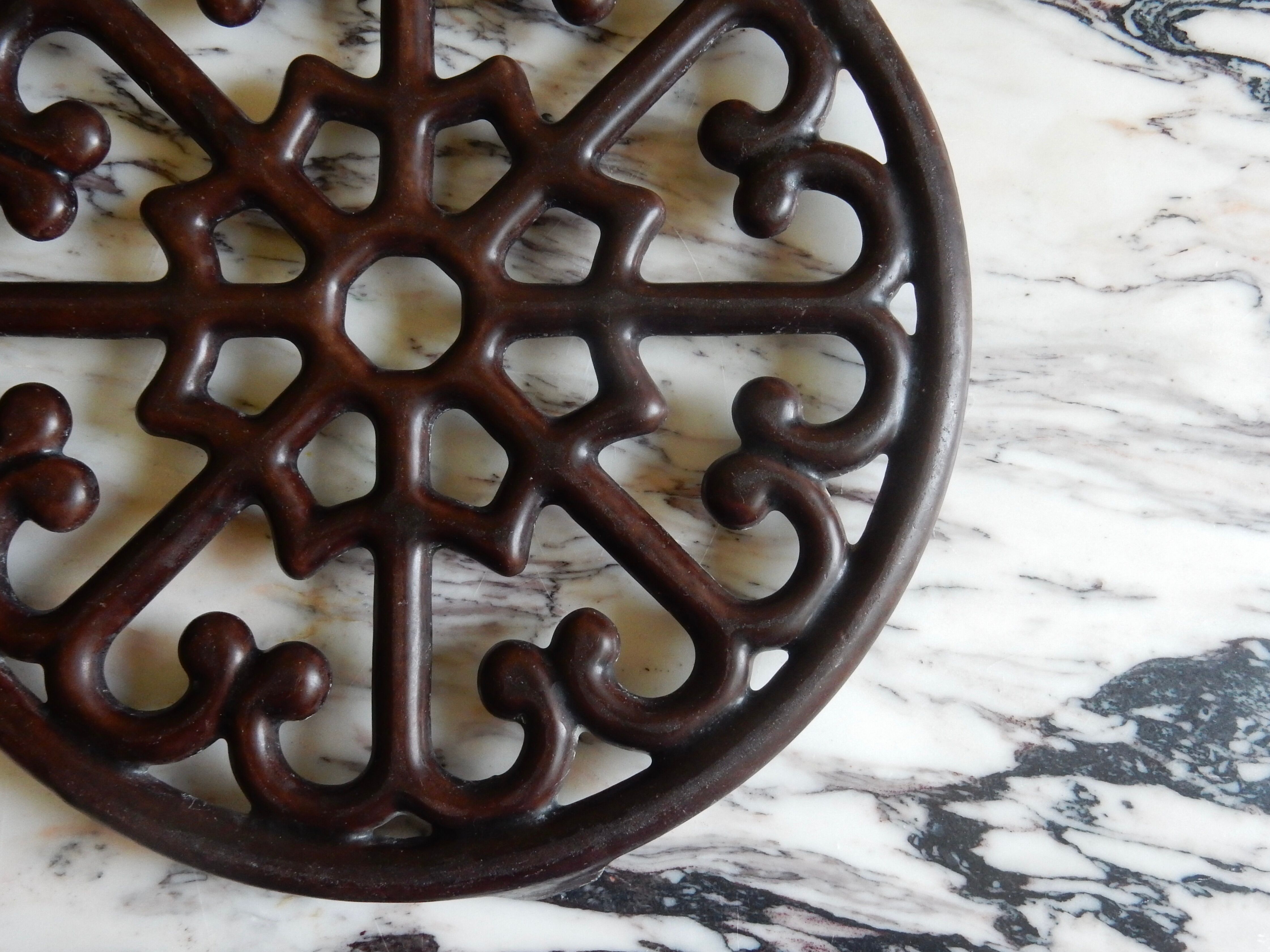 Brown enamelled cast iron trivet