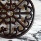 Brown enamelled cast iron trivet