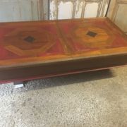 Coffee table with storage for bottles and glasses in oak.