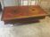 Coffee table with storage for bottles and glasses in oak.