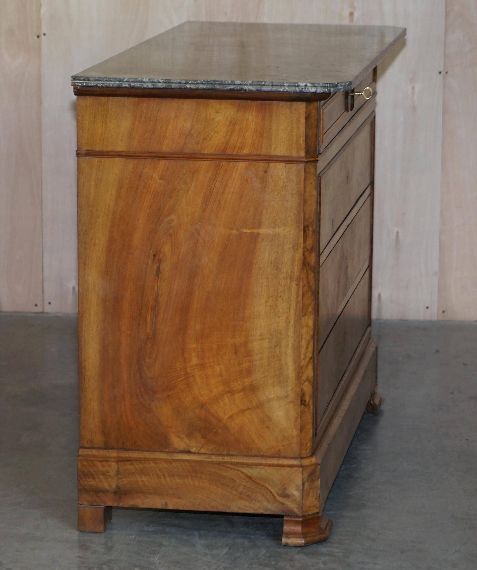 Antique walnut commode from 1860 with a marble top and original key.