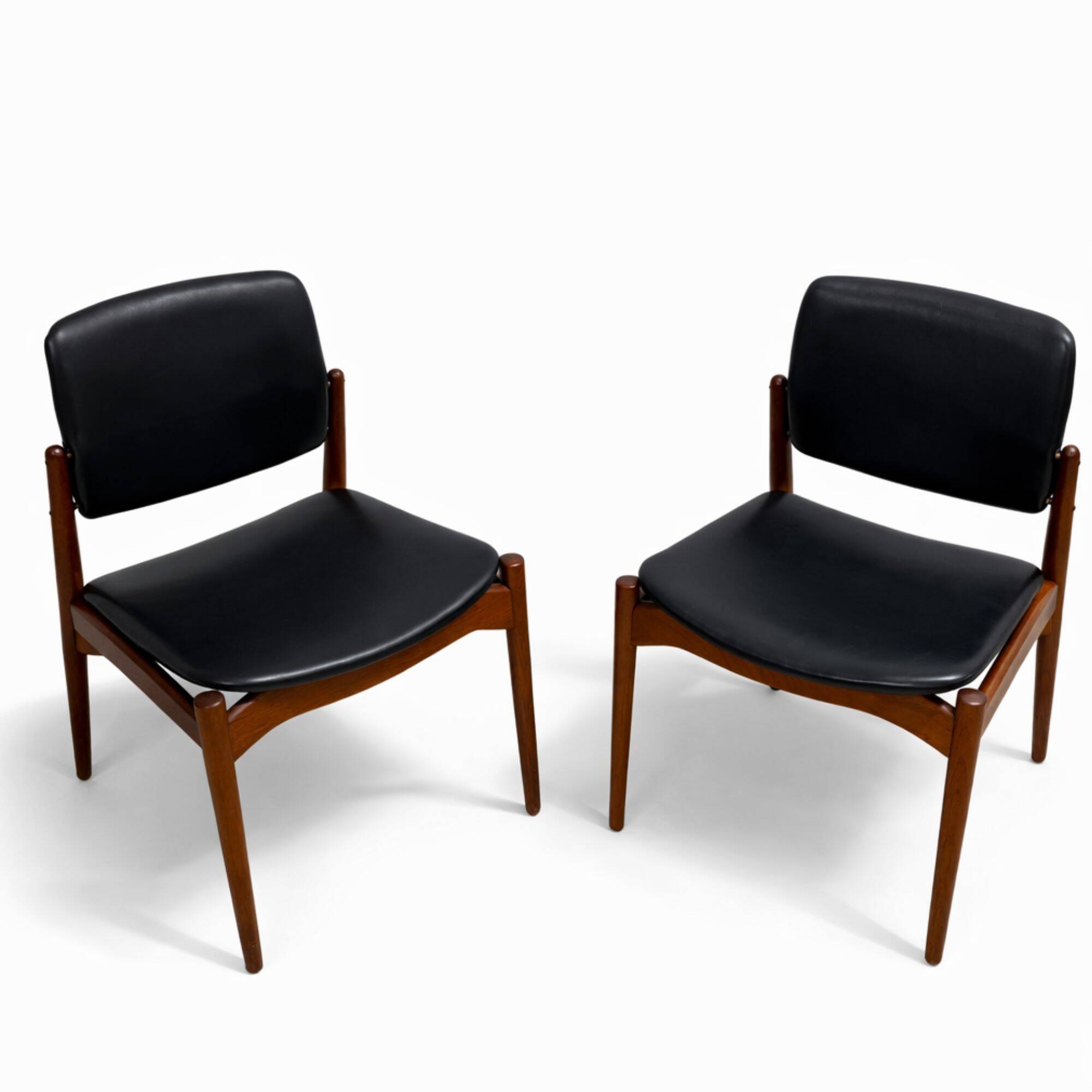 Captain chair pair by Erik Buch