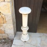 Light-lit white marble column