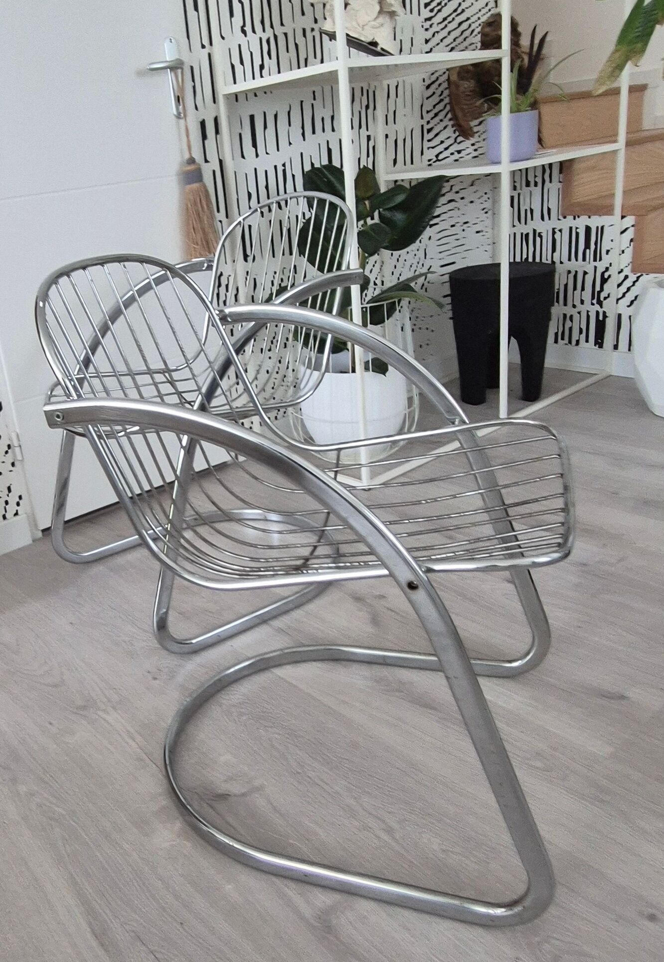 A pair of space age wire chairs