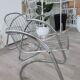 A pair of space age wire chairs