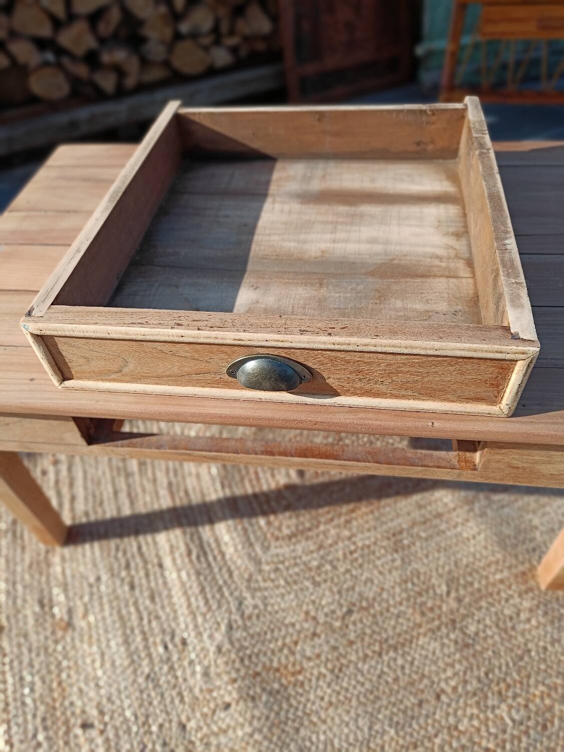 Low farmhouse table in raw wood