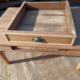 Low farmhouse table in raw wood