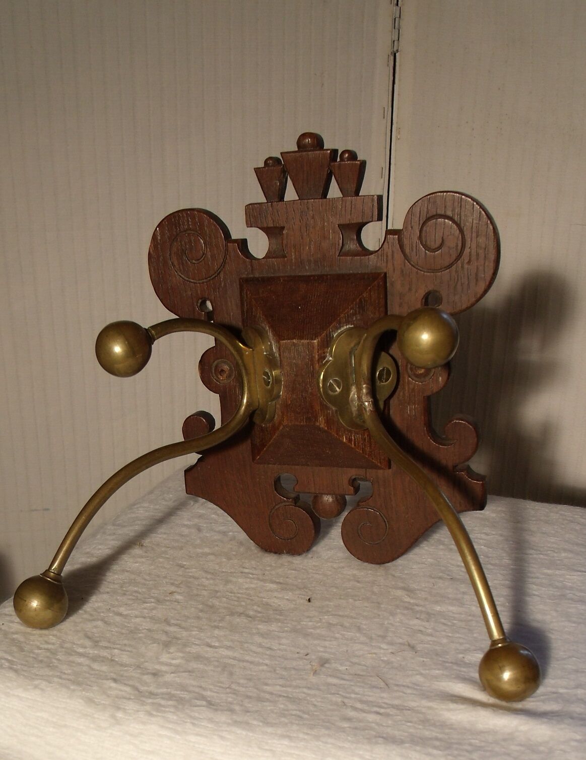 Former wooden and brass wall coat racks