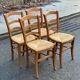 4 solid wood straw-seated Louis Philippe chairs, oak, 20th century.