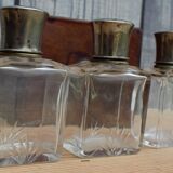 Antique leather case with 3 beveled bottles