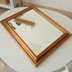 Miroir doré vintage à glace biseautée