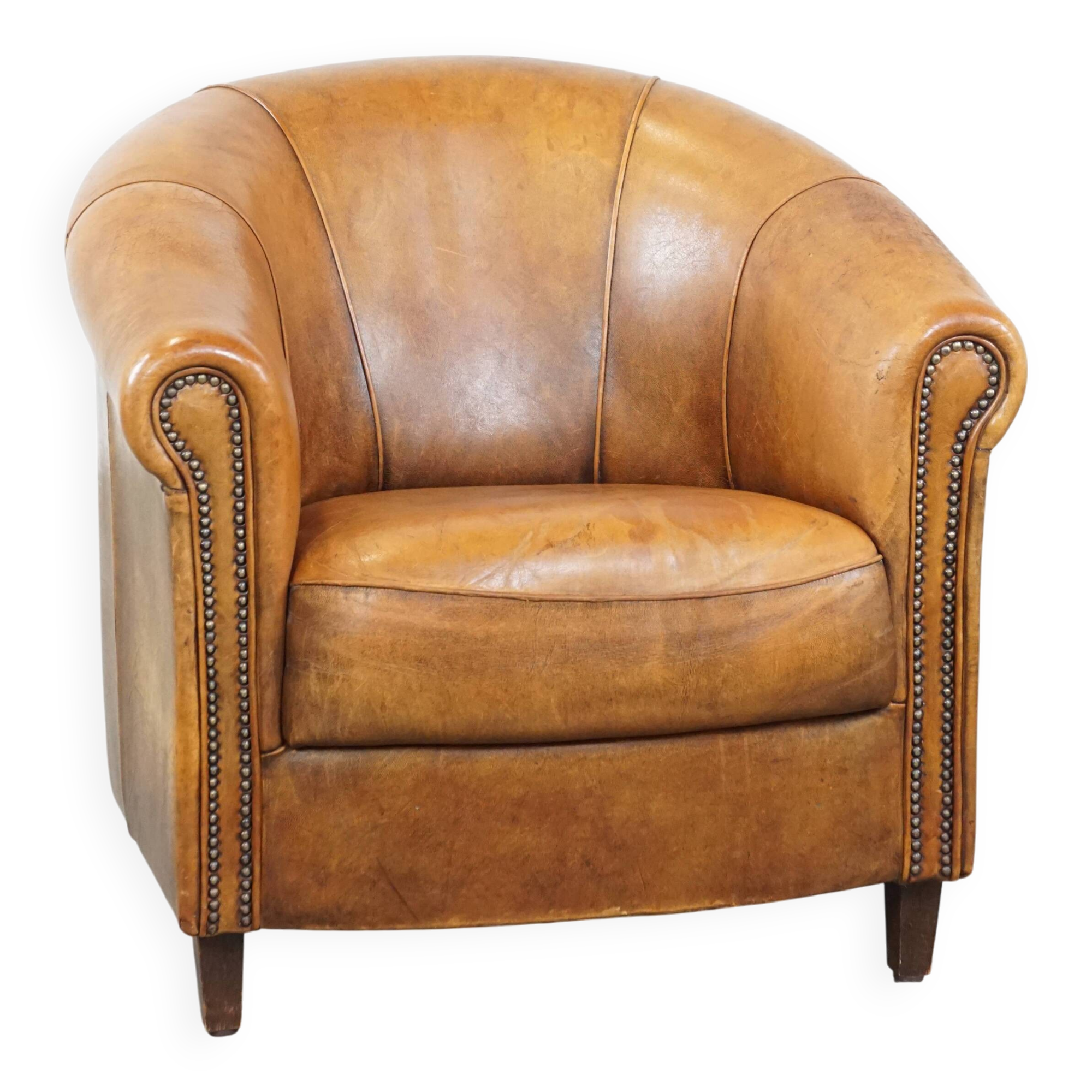 Cognac-colored sheep leather club chair with patina