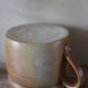 Vase terracotta milk jug with a glazed interior handle.