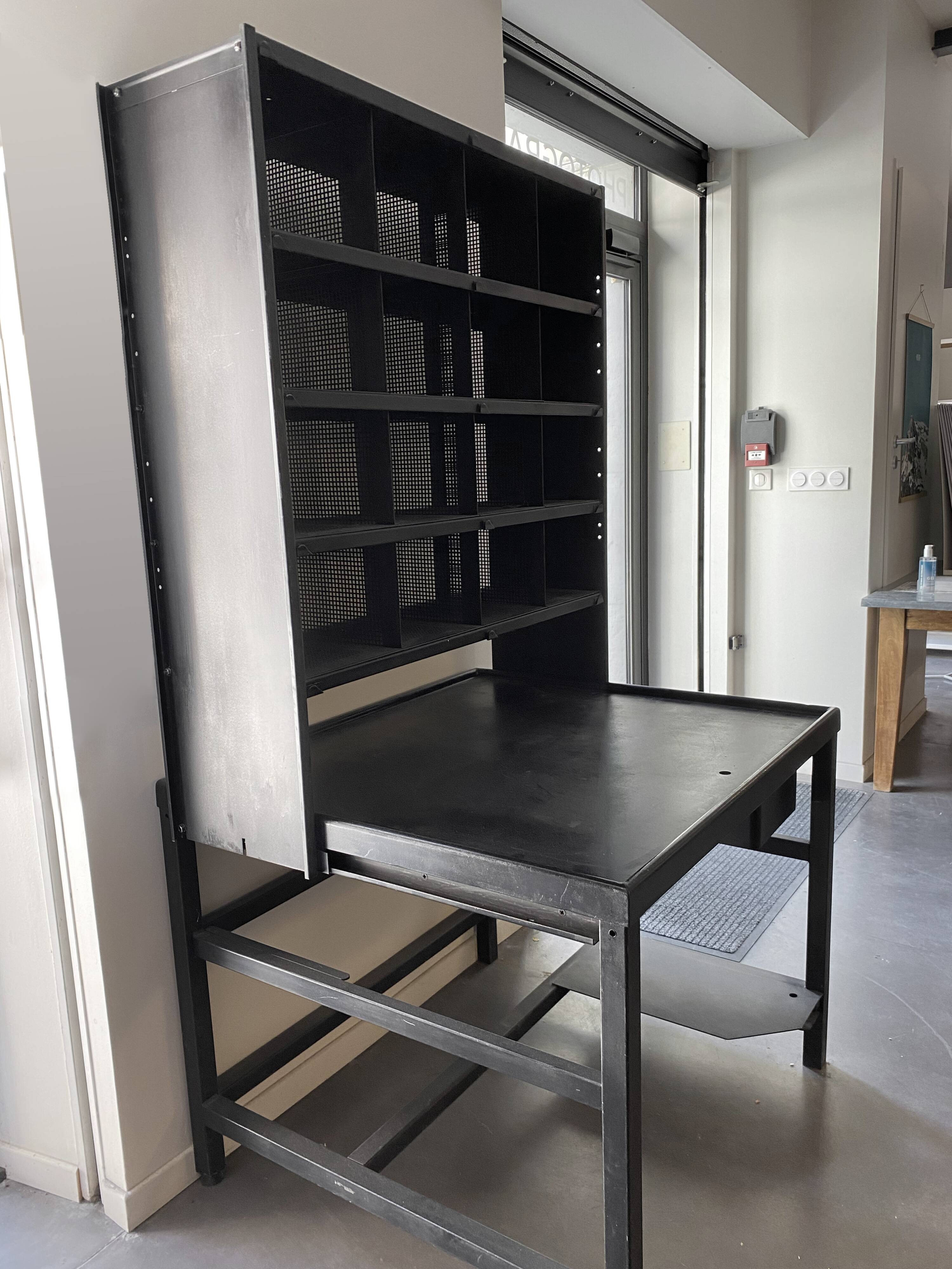Postal sorting desk with a sliding top part back and forth.