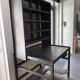 Postal sorting desk with a sliding top part back and forth.