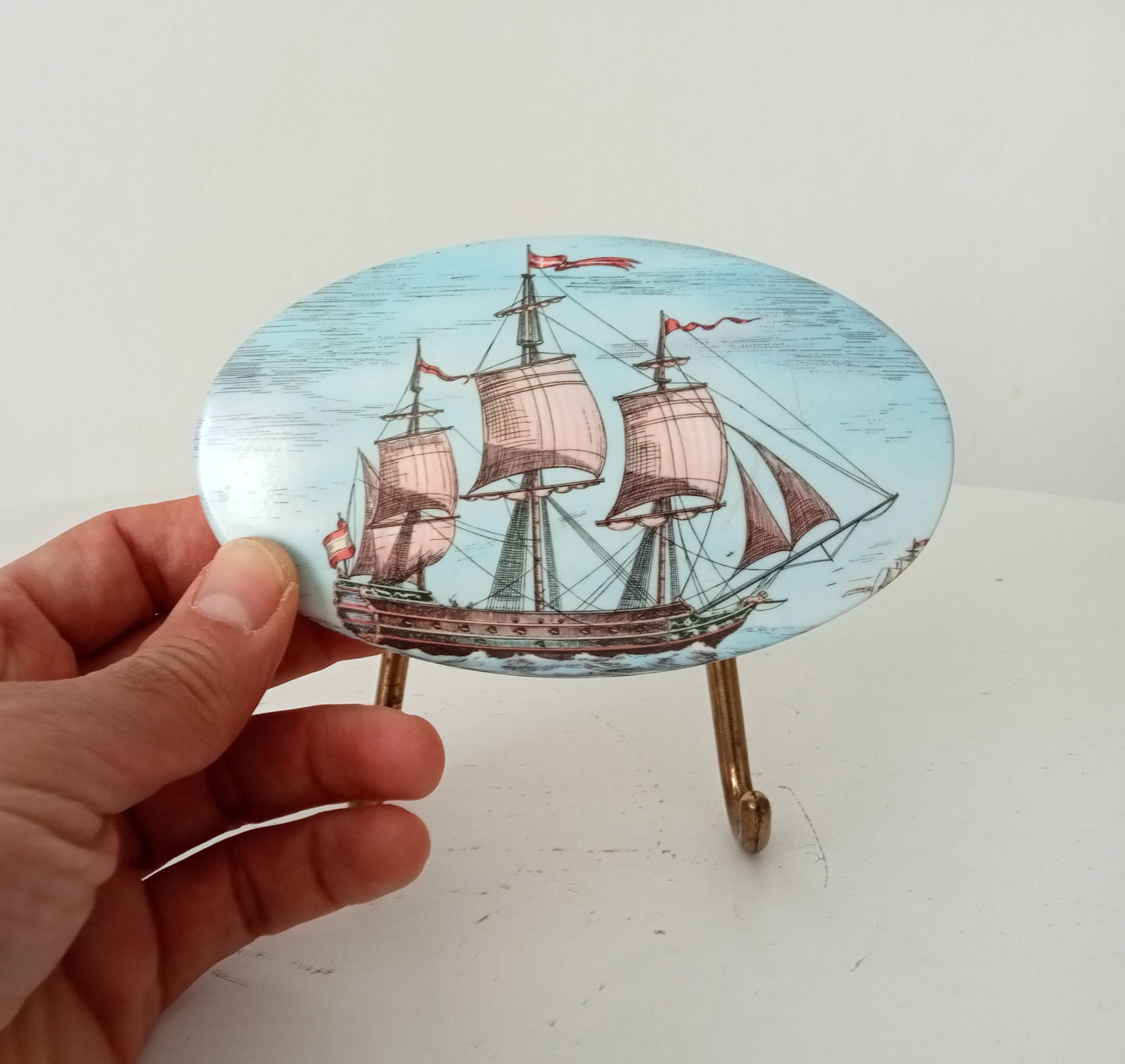 Vintage wall coat hook in brass and Bakelite.