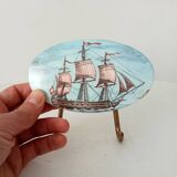 Vintage wall coat hook in brass and Bakelite.