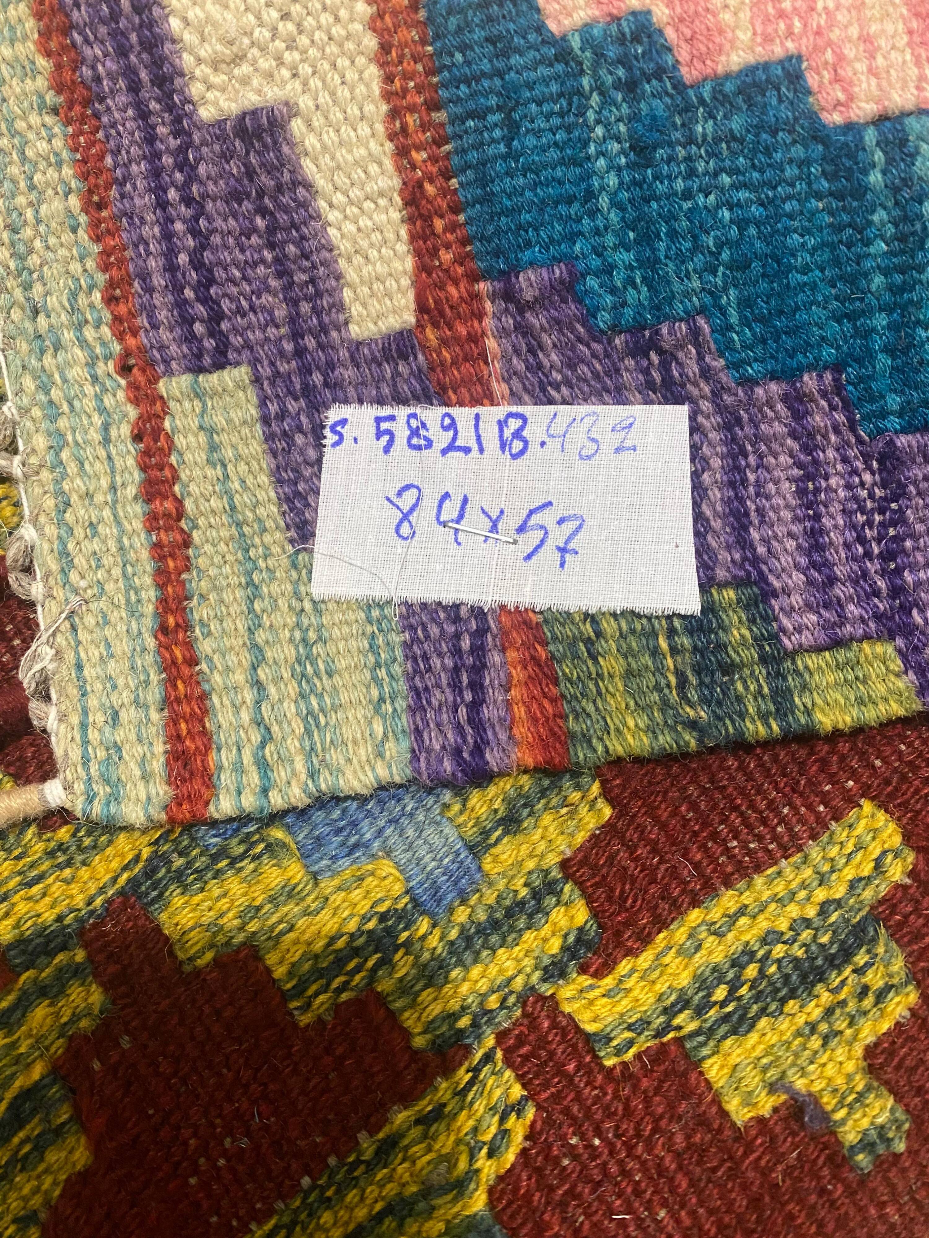 Afghan kilim rug in wool, pastel geometric patterns,