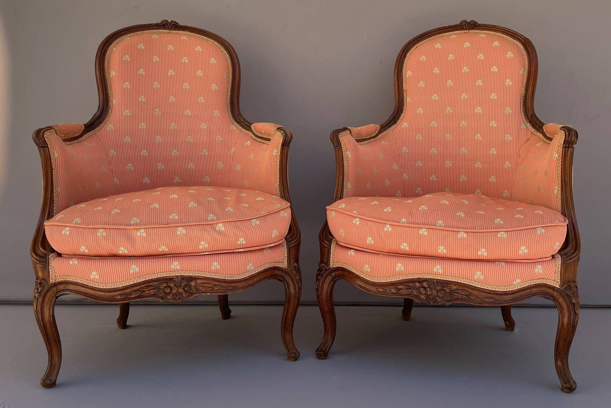 Pair of Louis XV period bergeres in walnut
