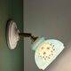 Vintage wall sconce with blue opaline glass shade and floral decorations