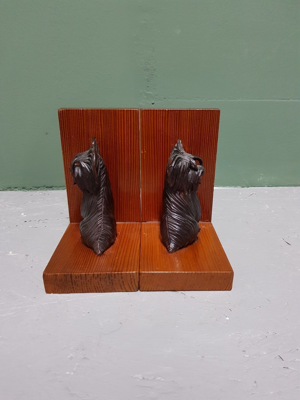 Mid 20th century wooden bookends with carved sitting dogs