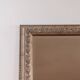 Parquet mirror, gold frame with a bead frieze.
