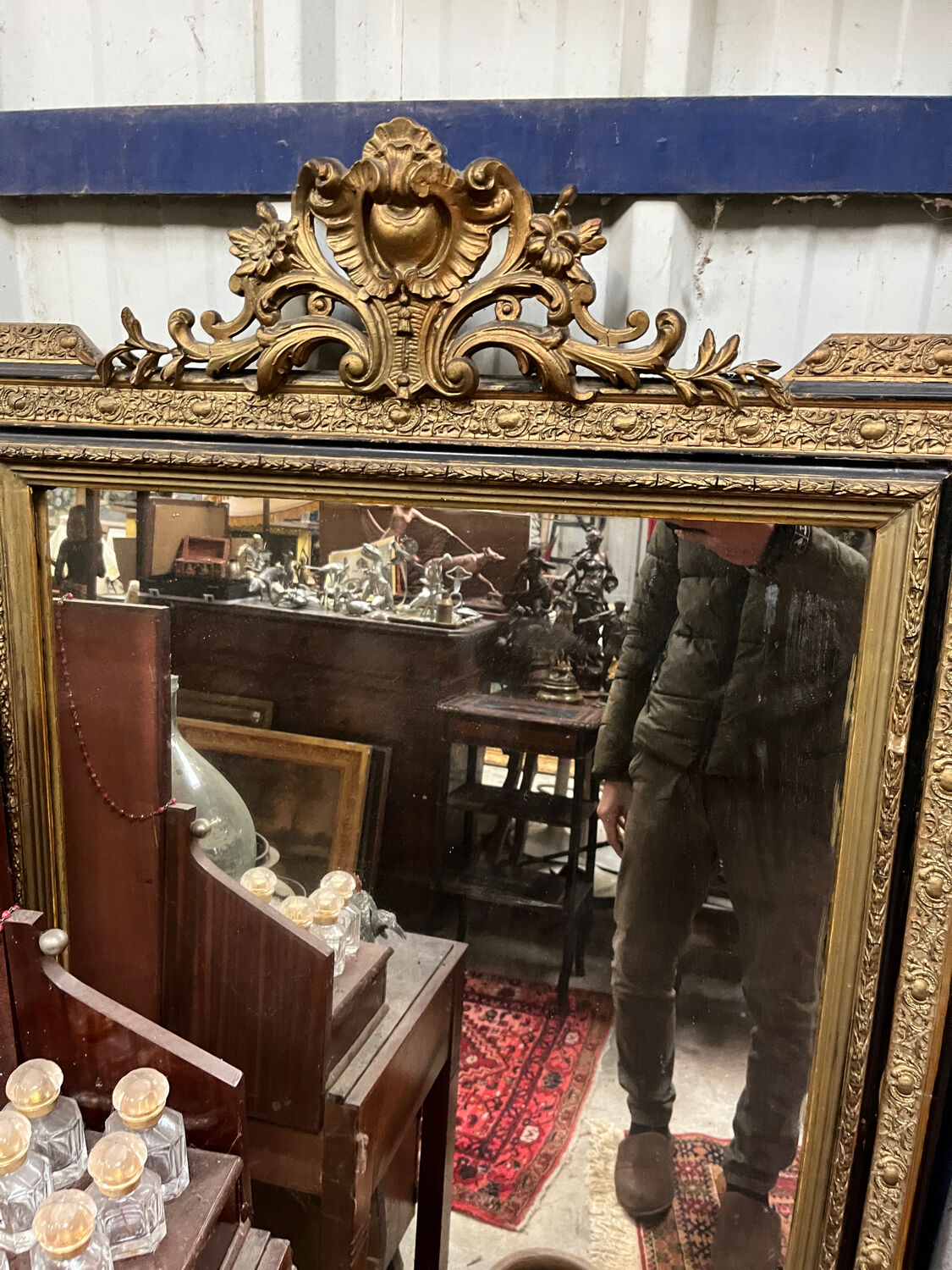 Large antique gilt mirror with scroll and shell decoration, 144 cm