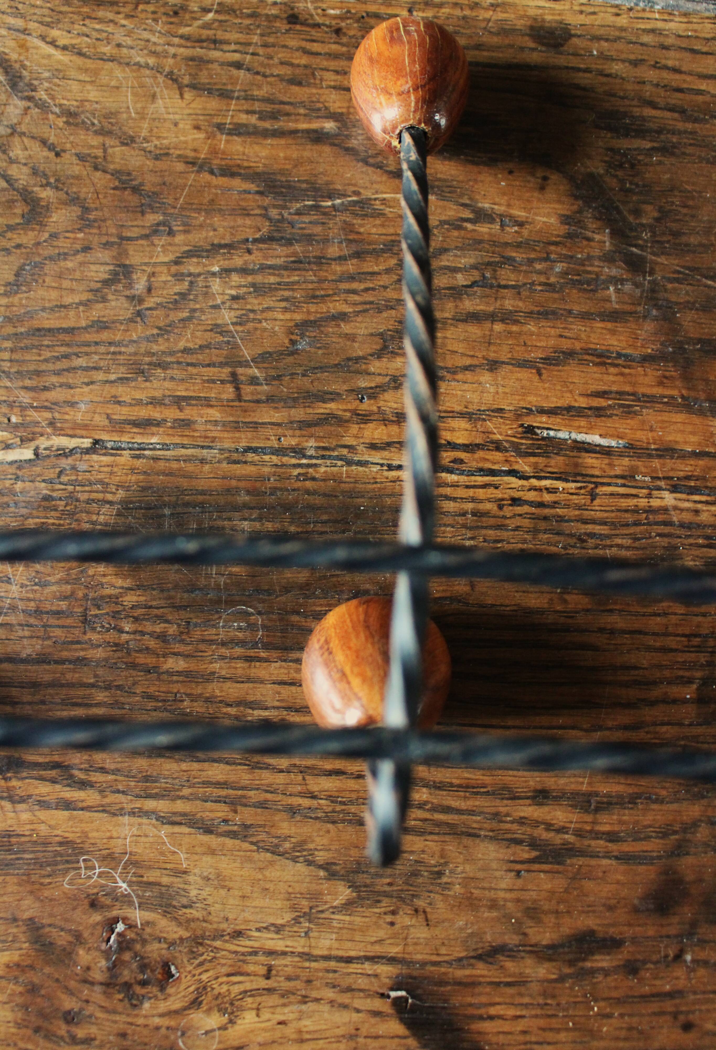 Double wrought iron coat rack with 3 double wooden ball hooks