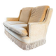 Vintage beige two-seater sofa with fringes