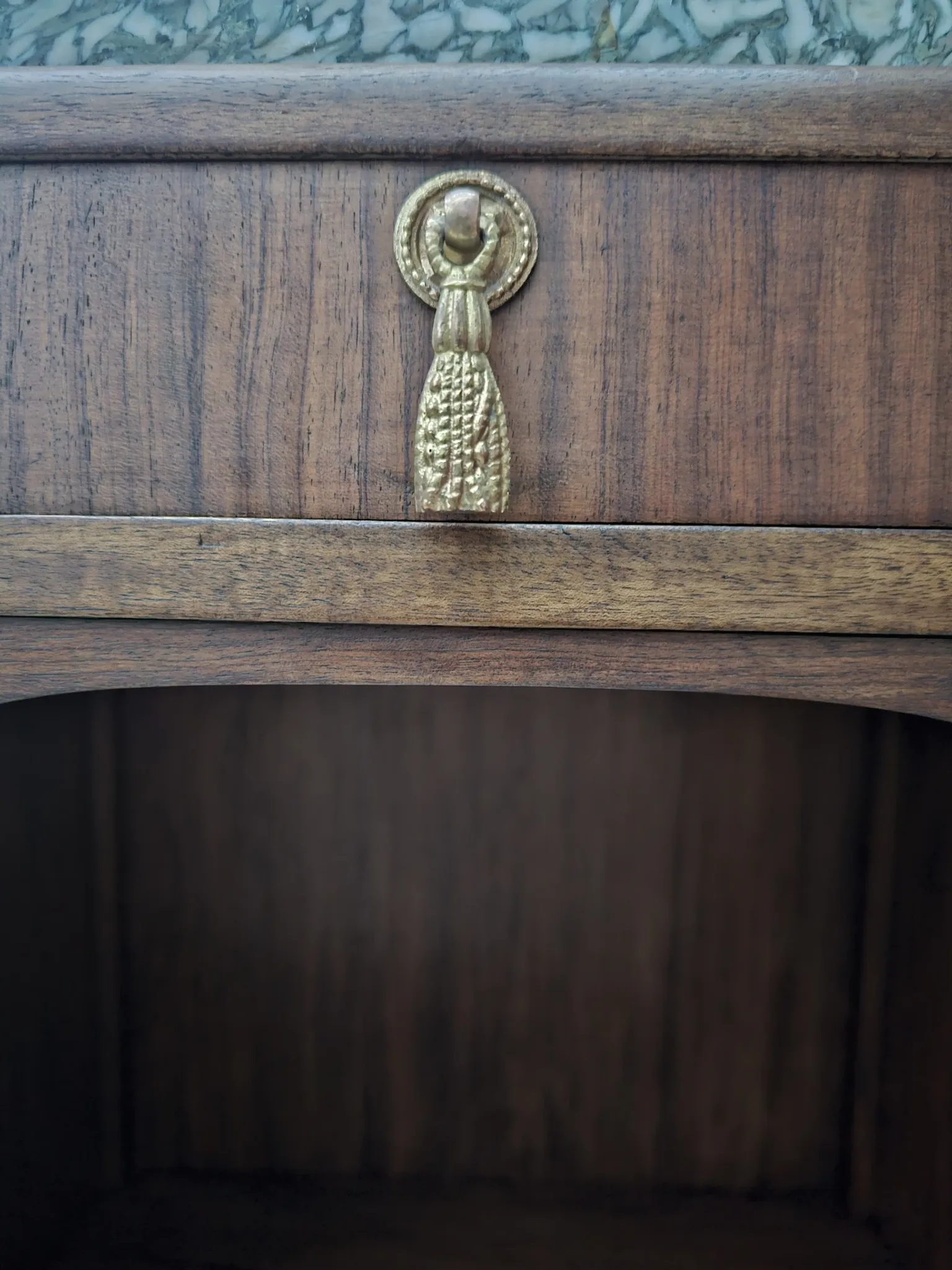 Art Deco bedside table with a green marble top.