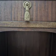 Art Deco bedside table with a green marble top.