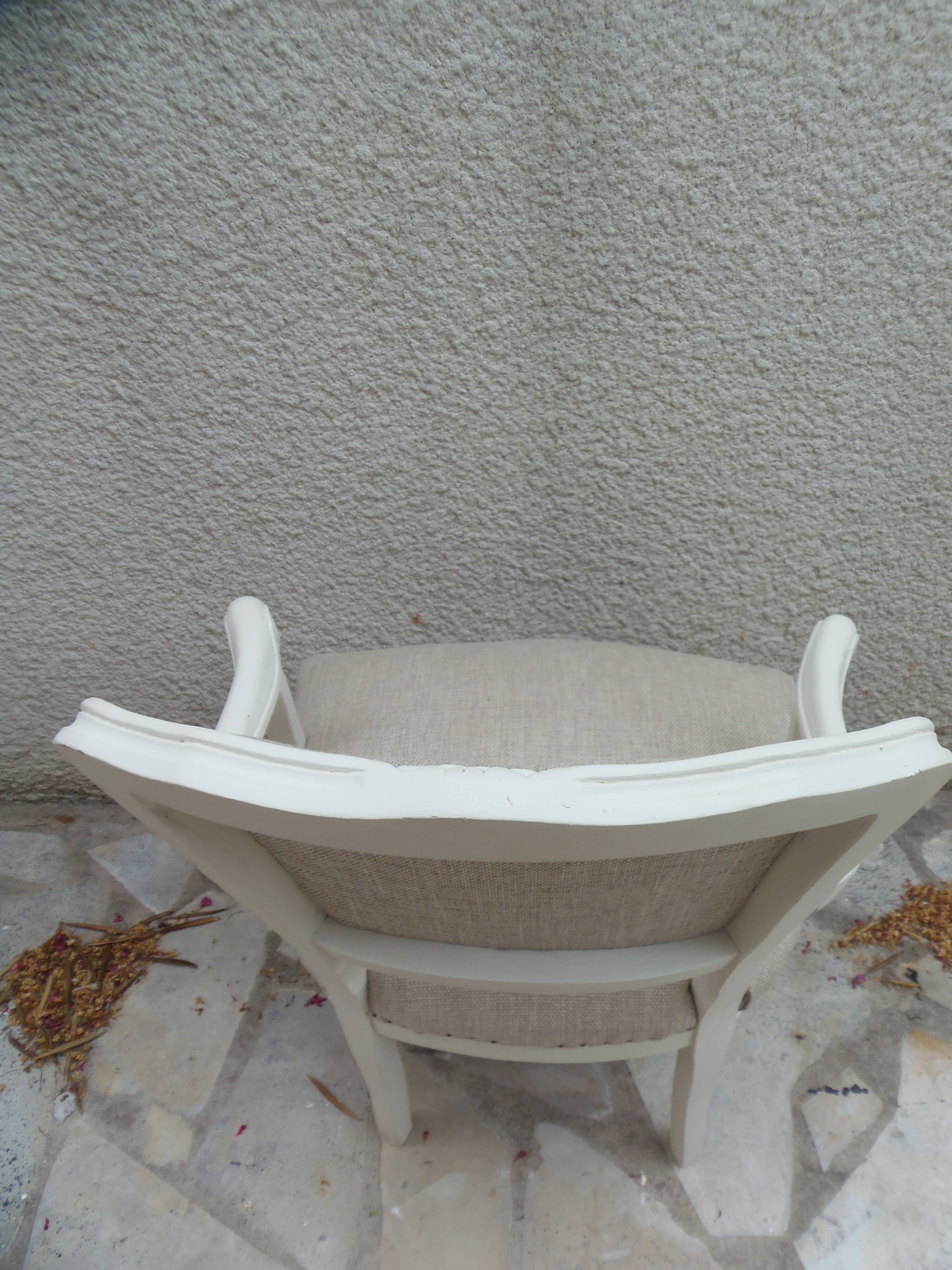 Louis XV style armchair in patinated beige, upholstered in beige fabric.