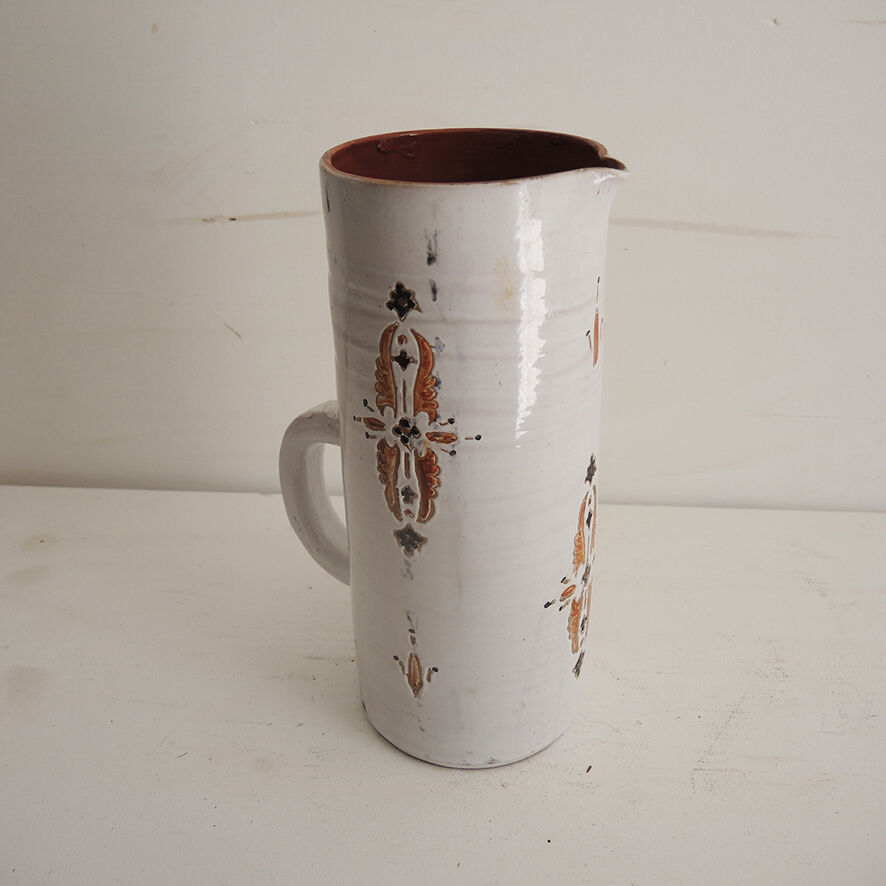 Old glazed terracotta carafe with signature