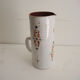 Old glazed terracotta carafe with signature